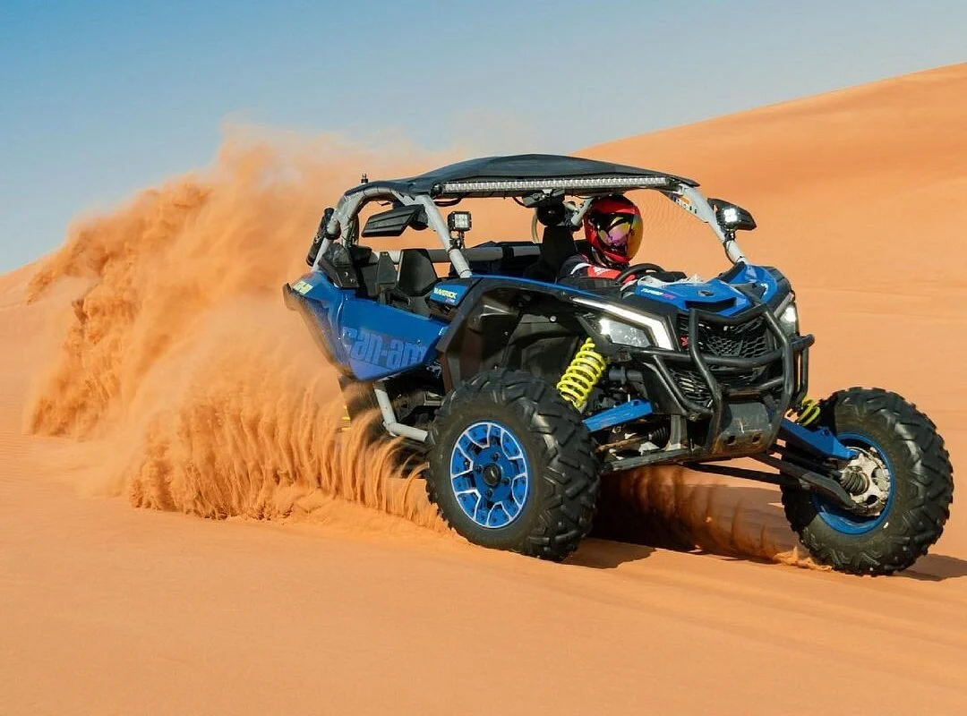 Dubai desert safari at sunset with camel caravan